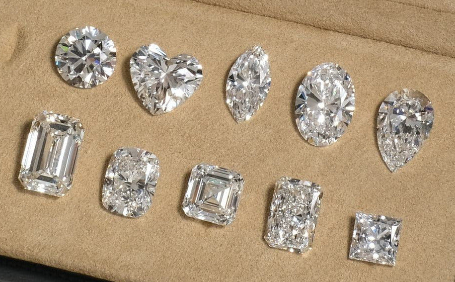 Ten loose lab grown diamonds in a stone case, one of each cut