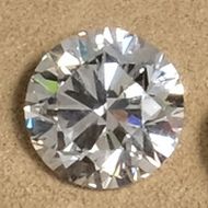 a loose round cut diamond photographed in our showroom