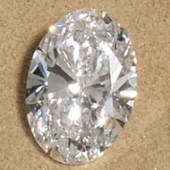 a loose oval cut diamond photographed in our showroom