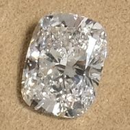 a loose cushion cut diamond photographed in our showroom