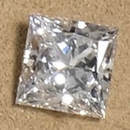 a loose princess cut diamond photographed in our showroom