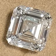 a loose asscher cut diamond photographed in our showroom